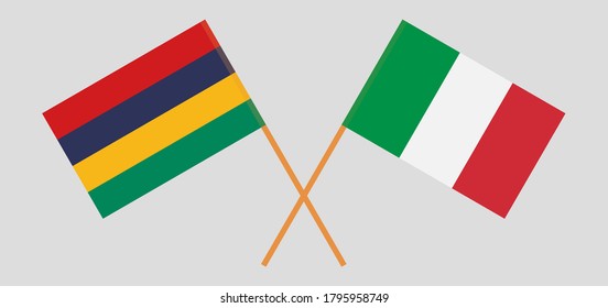 Crossed and waving flags of Mauritius and Italy