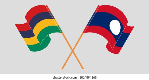 Banderas cruzadas y ondeando banderas de Mauricio y Laos