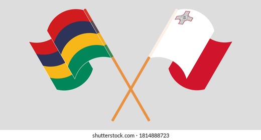 Crossed and waving flags of Mauritius and Malta