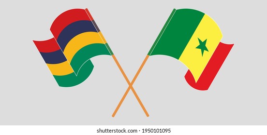 Crossed and waving flags of Mauritius and Senegal