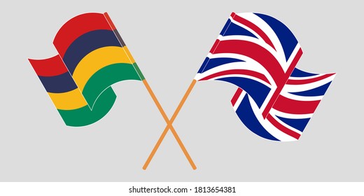 Crossed and waving flags of Mauritius and the UK. Vector illustration
