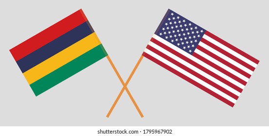 Crossed and waving flags of Mauritius and the USA