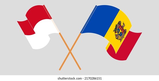 Crossed and waving flags of Monaco and Moldova. Vector illustration

