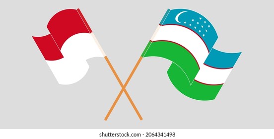 Crossed and waving flags of Monaco and Uzbekistan