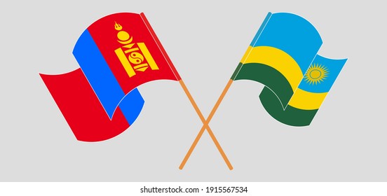 Banderas cruzadas y ondeando banderas de Mongolia y Ruanda