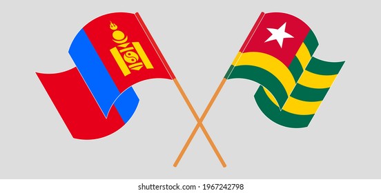 Crossed and waving flags of Mongolia and Togo