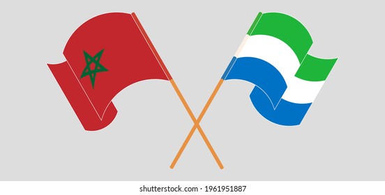 Crossed and waving flags of Morocco and Sierra Leone