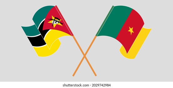 Crossed and waving flags of Mozambique and Cameroon