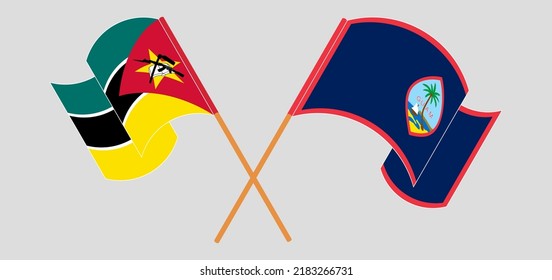 Crossed and waving flags of Mozambique and Guam. Vector illustration
