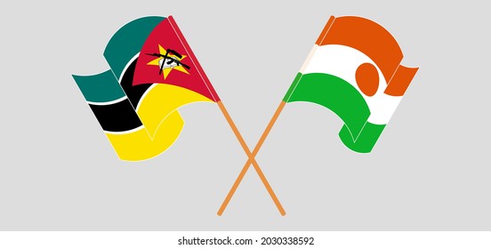 Crossed and waving flags of Mozambique and Niger