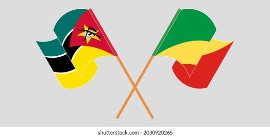 Crossed and waving flags of Mozambique and Republic of the Congo