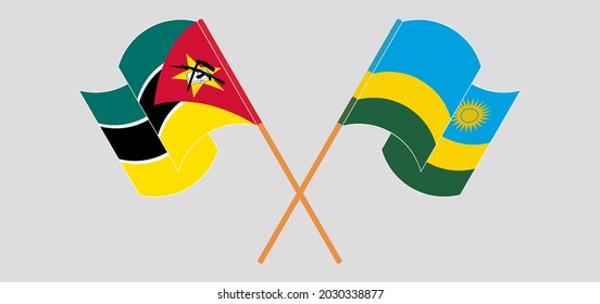 Crossed and waving flags of Mozambique and Rwanda