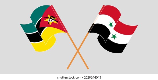 Crossed and waving flags of Mozambique and Syria