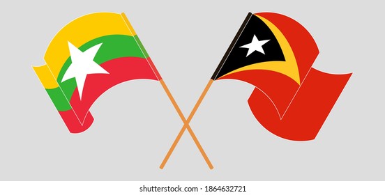  Crossed and waving flags of Myanmar and East Timor