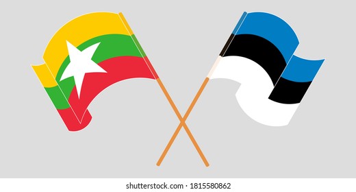 Crossed and waving flags of Myanmar and Estonia