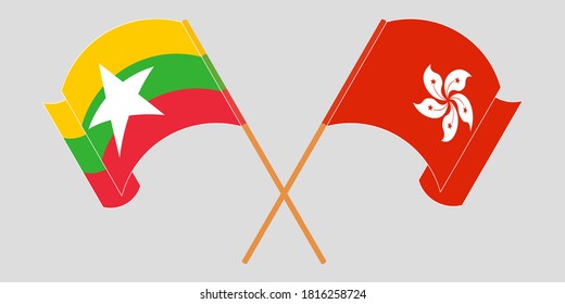 Crossed and waving flags of Myanmar and Hong Kong