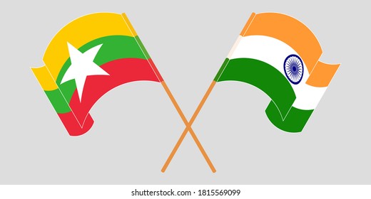 Banderas cruzadas y ondeando banderas de Myanmar e India