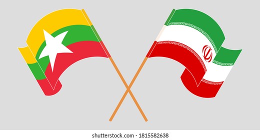 Banderas cruzadas y ondeando banderas de Myanmar e Irán
