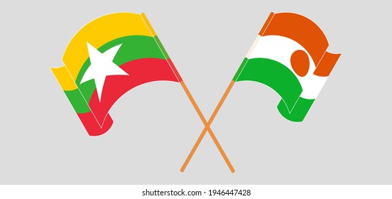 Crossed and waving flags of Myanmar and Niger
