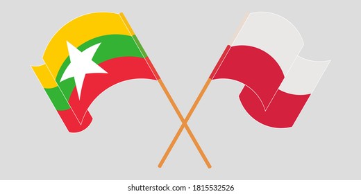 Crossed and waving flags of Myanmar and Poland