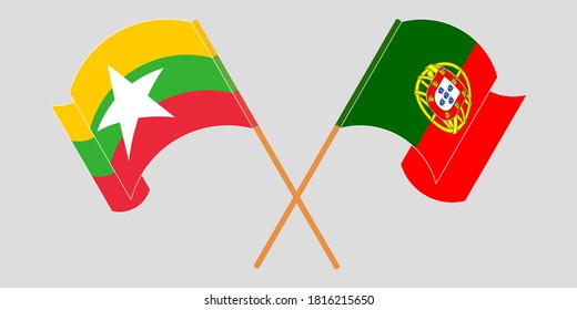 Crossed and waving flags of Myanmar and Portugal