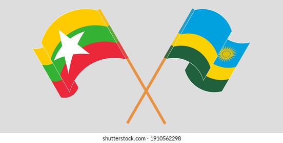 Crossed and waving flags of Myanmar and Rwanda