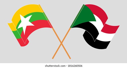 Crossed and waving flags of Myanmar and Sudan