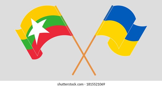 Crossed and waving flags of Myanmar and the Ukraine