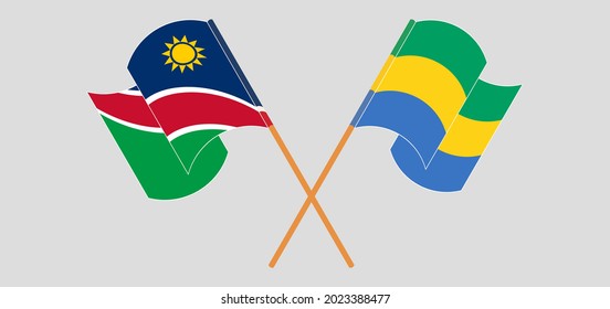 Banderas cruzadas y ondeando banderas de Namibia y Gabón