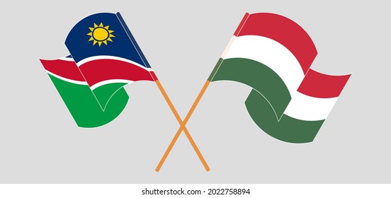 Crossed and waving flags of Namibia and Hungary
