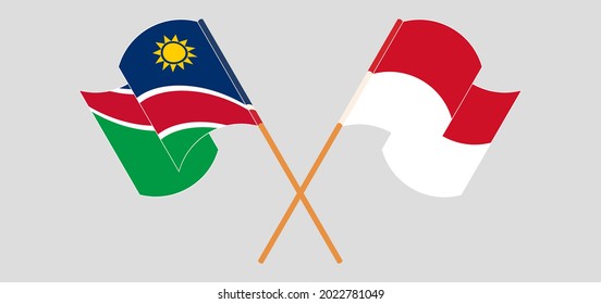 Crossed and waving flags of Namibia and Indonesia