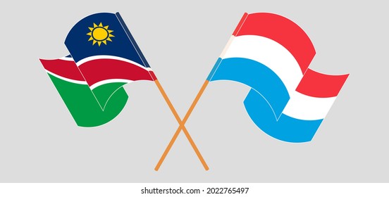 Crossed and waving flags of Namibia and Luxembourg