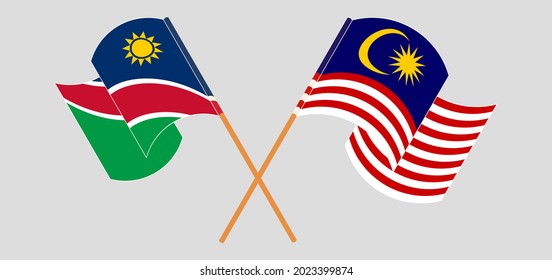 Banderas cruzadas y ondeando banderas de Namibia y Malasia