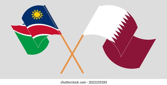 Crossed and waving flags of Namibia and Qatar