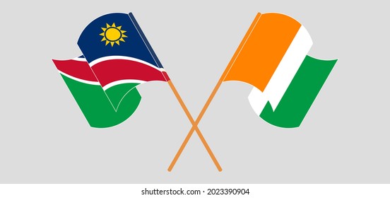 Banderas cruzadas y ondeando banderas de Namibia y la República de Costa de Marfil