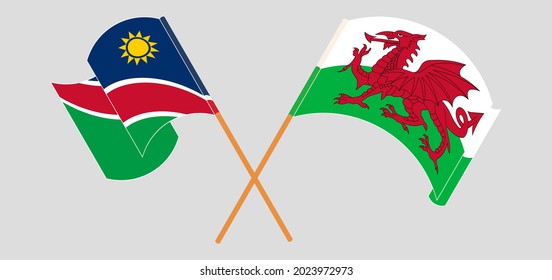 Banderas cruzadas y ondeando banderas de Namibia y Gales