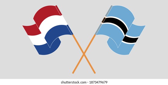 Crossed and waving flags of the Netherlands and Botswana