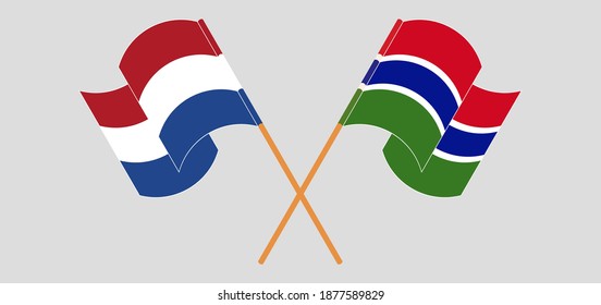 Crossed and waving flags of the Netherlands and the Gambia