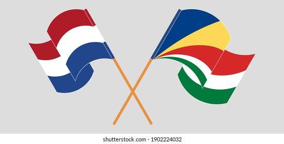 Crossed and waving flags of the Netherlands and Seychelles
