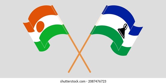 Crossed and waving flags of Niger and Kingdom of Lesotho. Vector illustration
