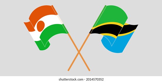 Banderas cruzadas y ondeando banderas de Níger y Tanzania