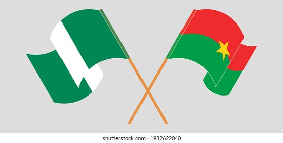 Crossed and waving flags of Nigeria and Burkina Faso