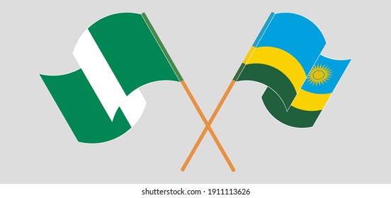 Crossed and waving flags of Nigeria and Rwanda