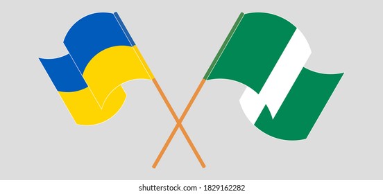 Crossed and waving flags of Nigeria and the Ukraine. Vector illustration

