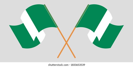 Crossed and waving flags of Nigeria. Vector illustration
