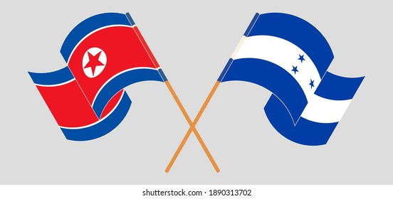 Crossed and waving flags of North Korea and Honduras
