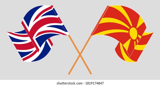 Crossed and waving flags of North Macedonia and the UK