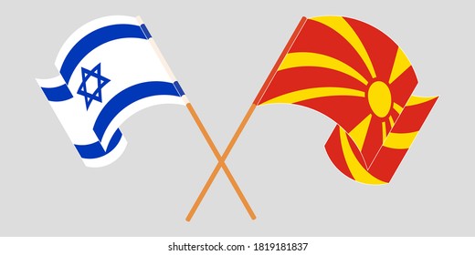 Crossed and waving flags of North Macedonia and Israel