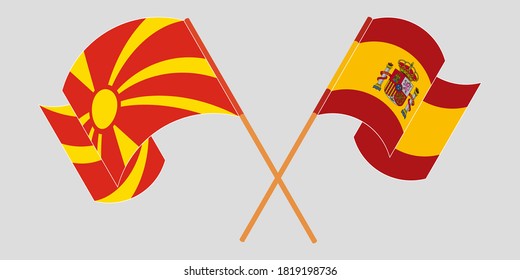 Banderas cruzadas y ondeando banderas del Norte de Macedonia y España