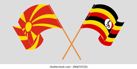 Crossed and waving flags of North Macedonia and Uganda